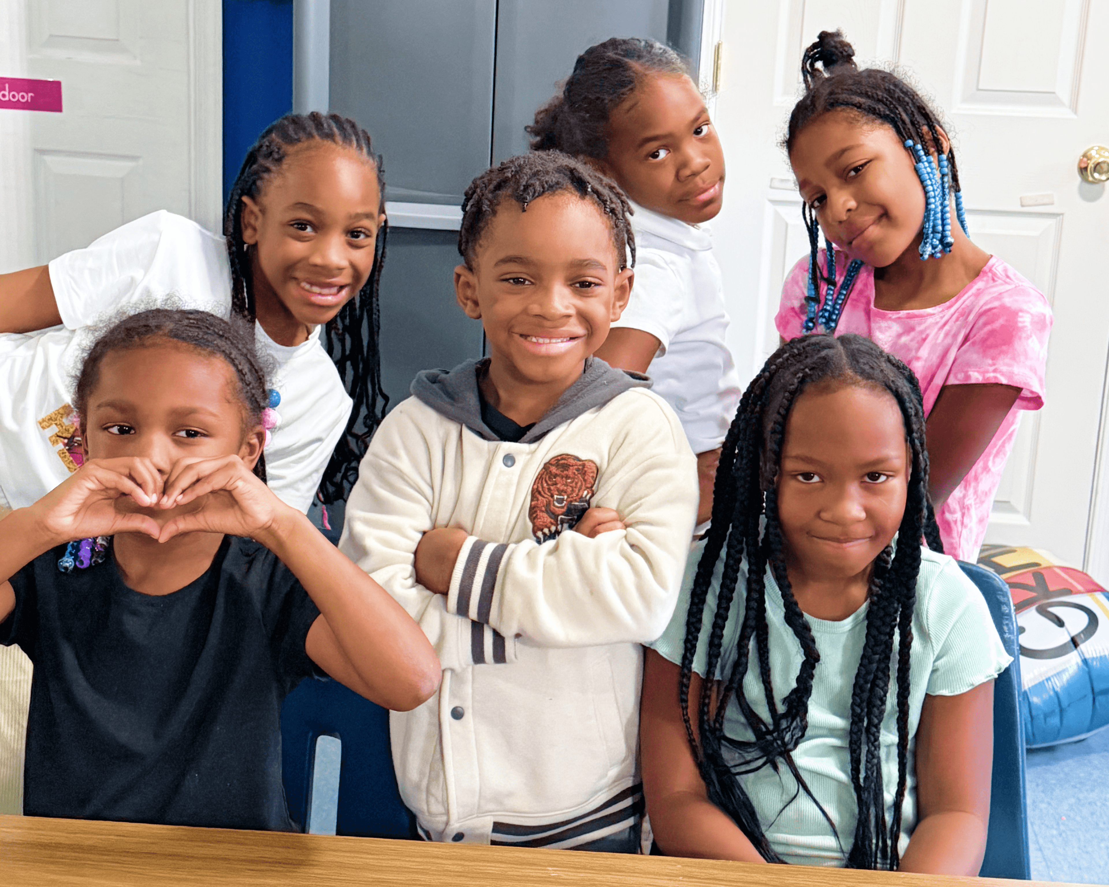 image of a group of kids laying on the ground smiling